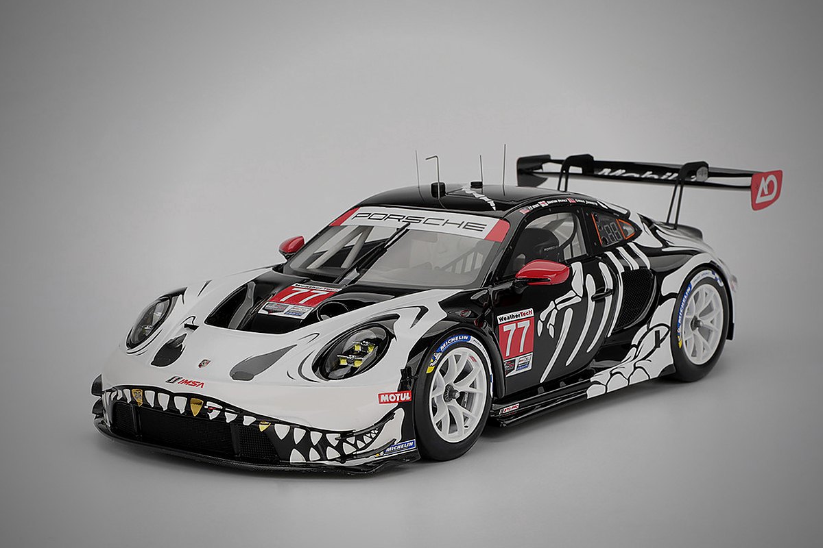Miniatura diecast de um Porsche de competição